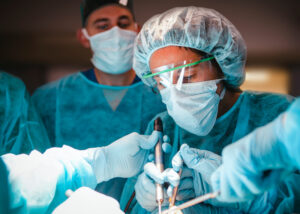 Oral and Maxillofacial surgery resident in training during a surgical simulation training lab.