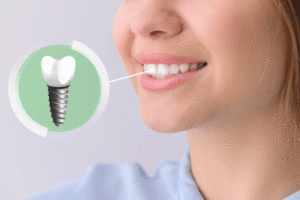 Young woman with implanted teeth on color background, closeup